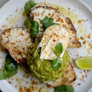 Avocado Toast on Crispy Ciabatta & Goat Cheese with Poach Egg and roasted pecan Nuts